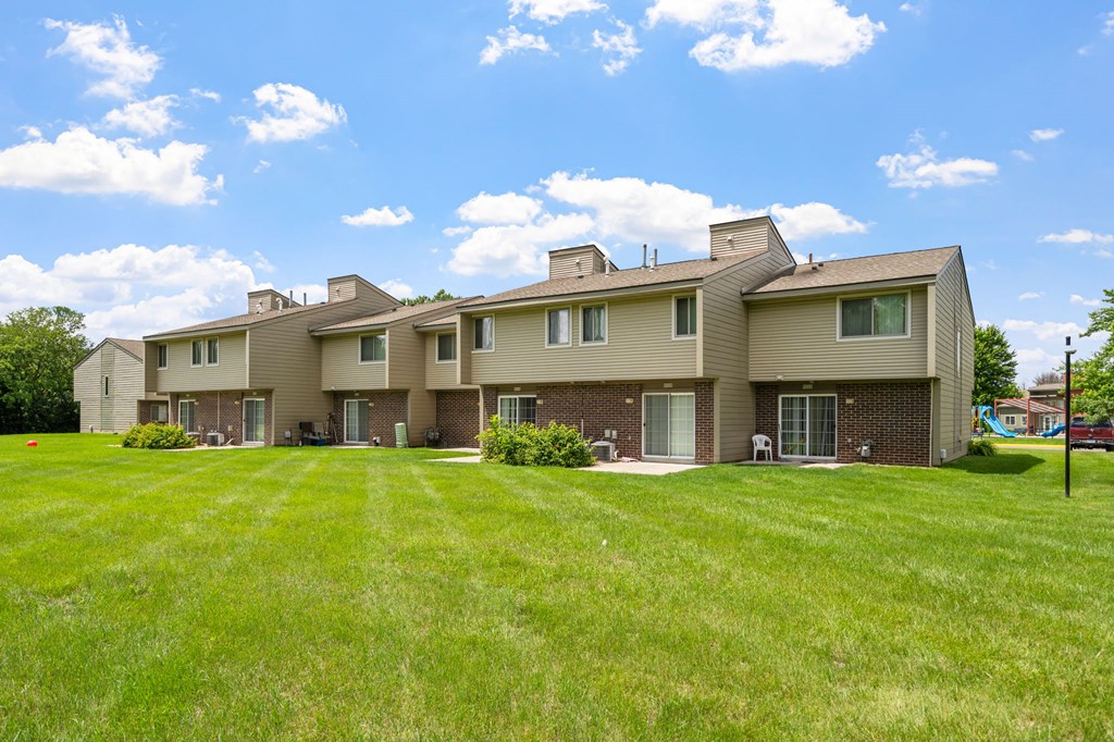 a large house with a yard in front of it