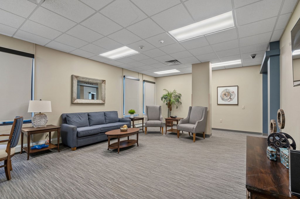 a living room with couches chairs and a table