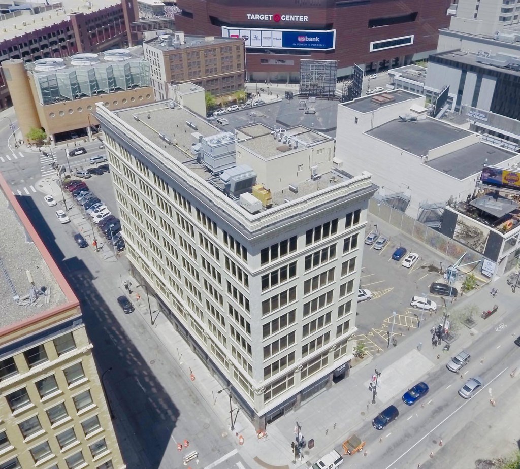 an aerial view of a large white building in a city