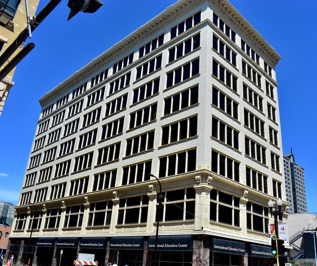an old building on the corner of a city street