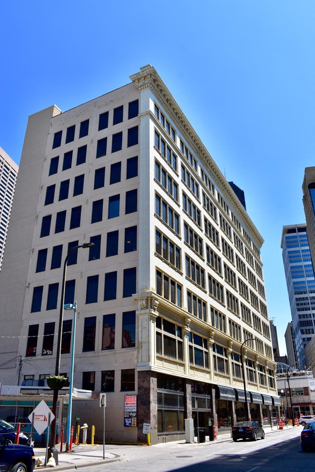 a large building on the corner of a city street