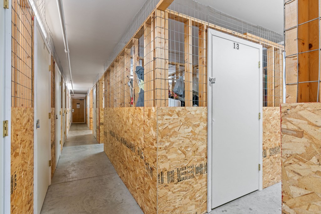a room filled with insulation and wooden walls and a white door