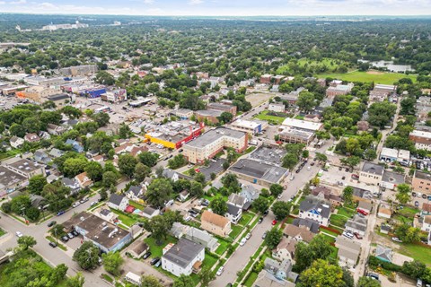 an aerial view of a city with buildings and trees