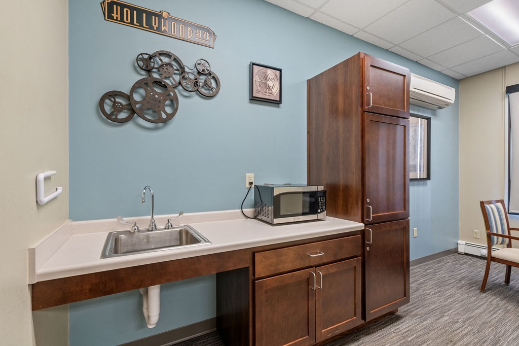 a kitchen with a sink and a microwave