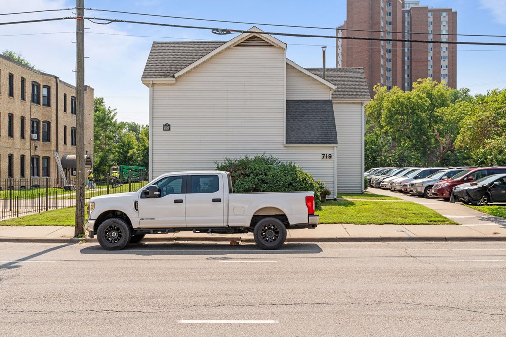 a white truck parked on the street in a parking lot