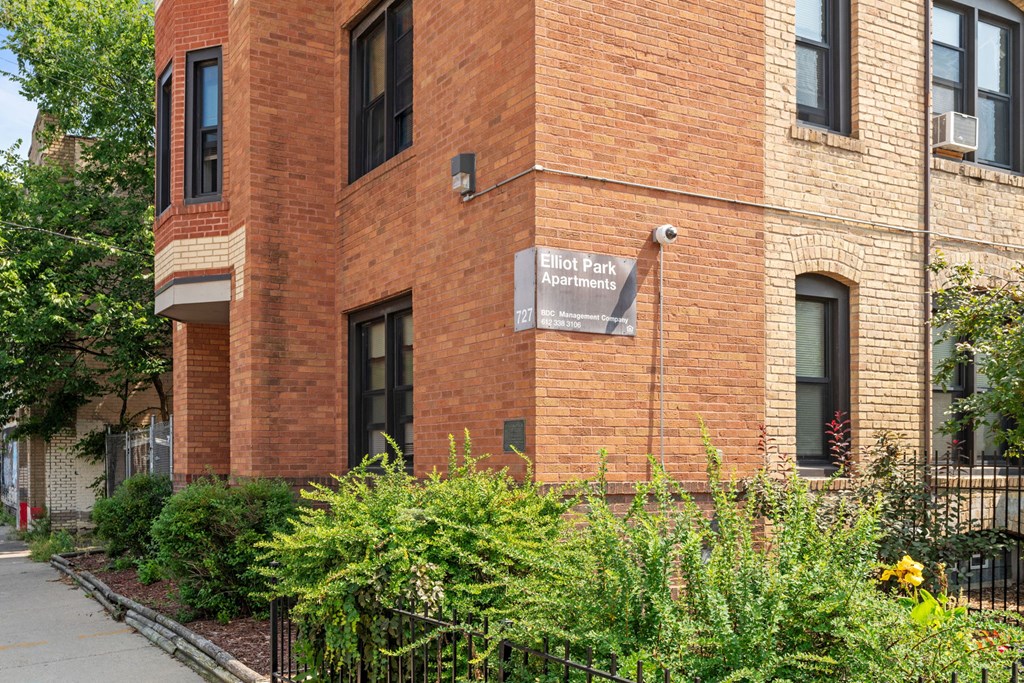 a brick building with a sign on the side of it