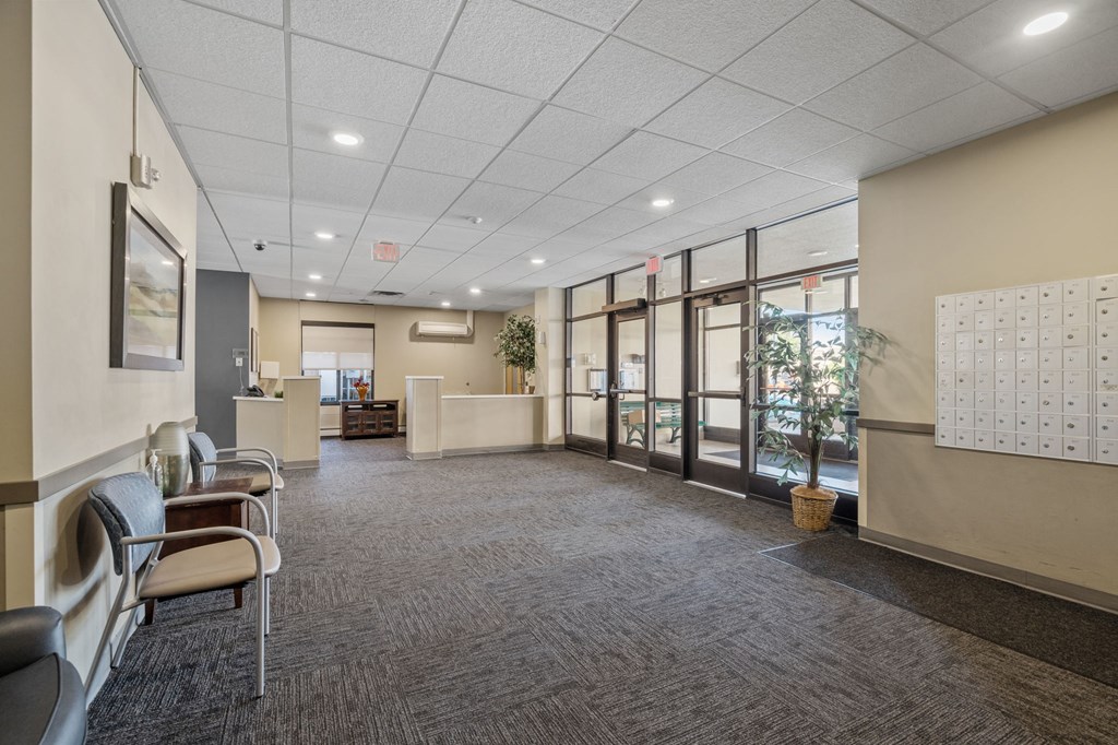 the preserve at cardinal courts spacious lobby with chairs and tables
