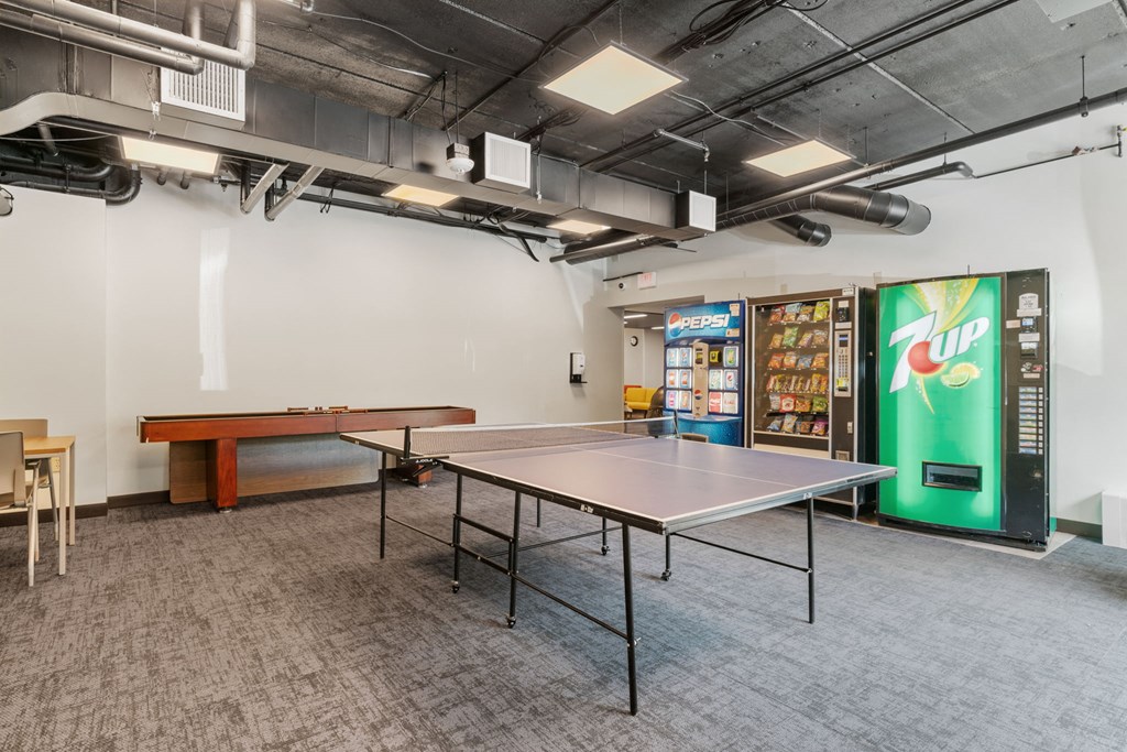 a room with a ping pong table and a pool table