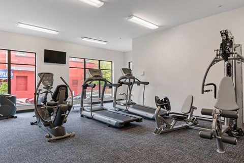 the gym has cardio equipment and weights at the flats