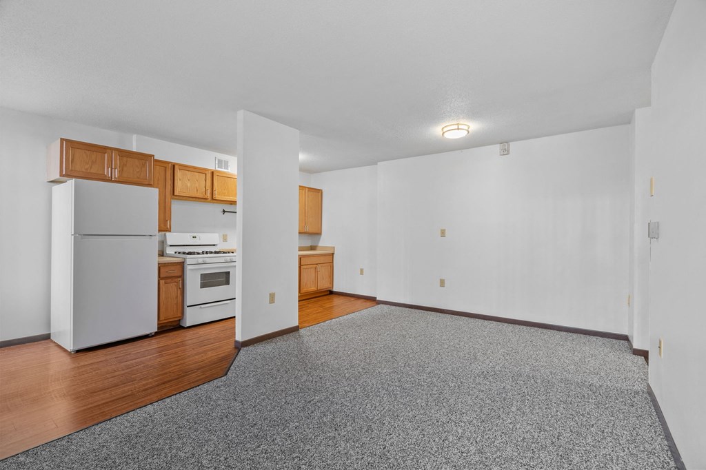 a kitchen with a refrigerator and a stove in it