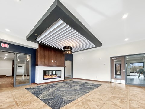 the preserve at cardinal courts lobby with fireplace and glass doors