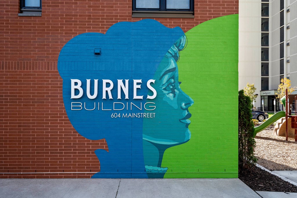 a mural on the side of a building of burnes building