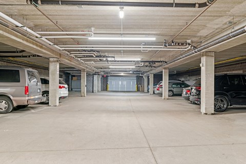 a parking garage with cars parked in it