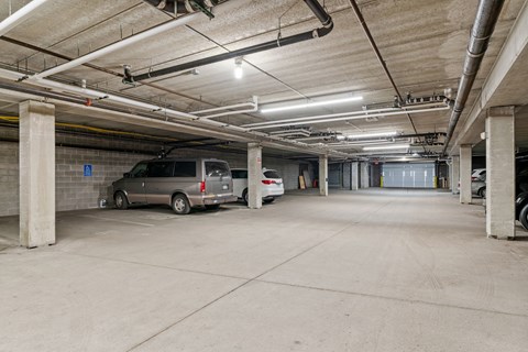 the parking garage at the top of the building has two parked cars