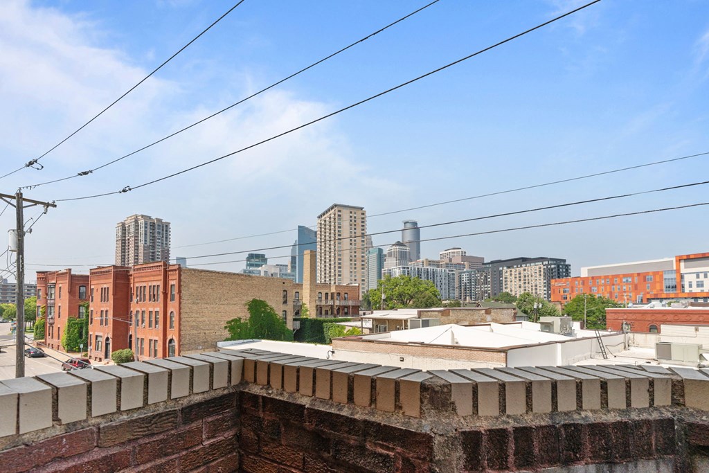 the view of the city from the roof of a building