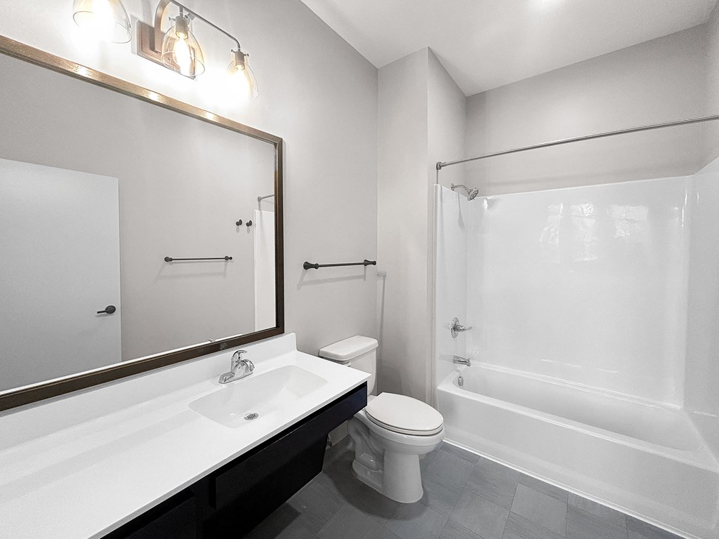 a bathroom with a sink toilet and a shower