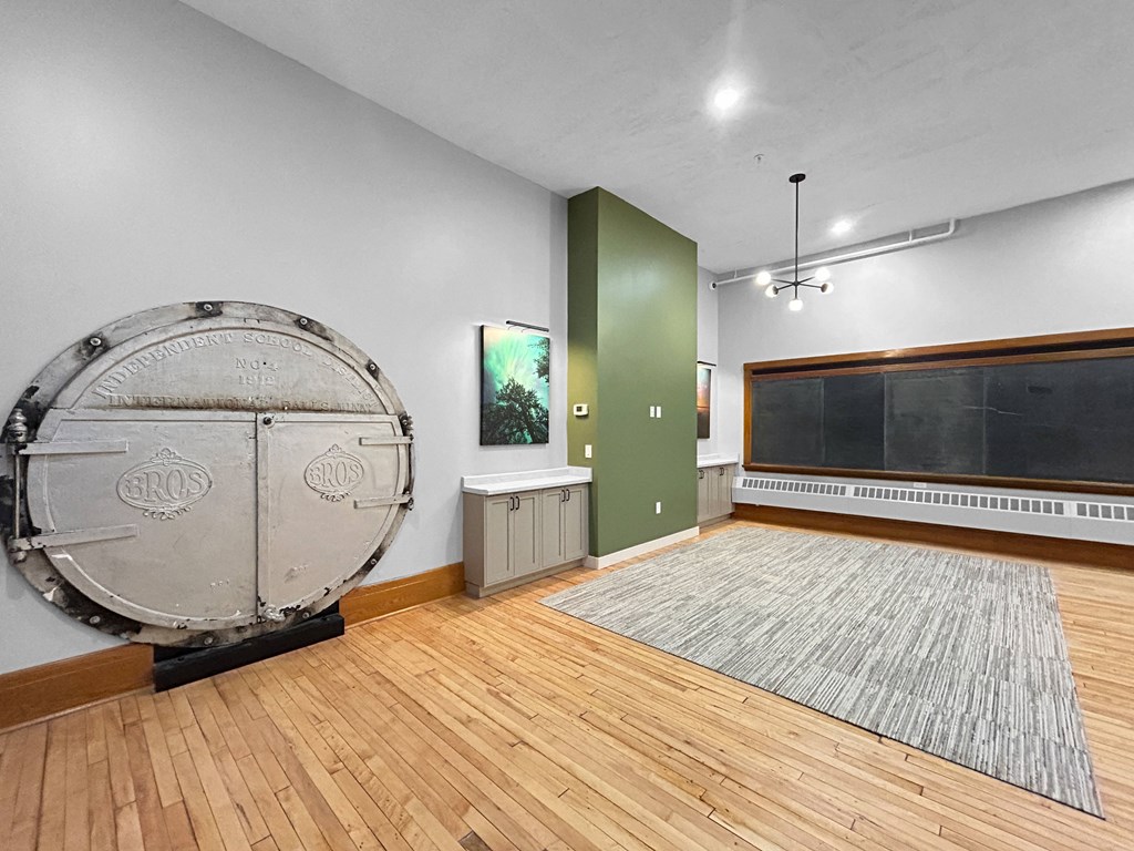 an empty room with a large drum in the middle of it