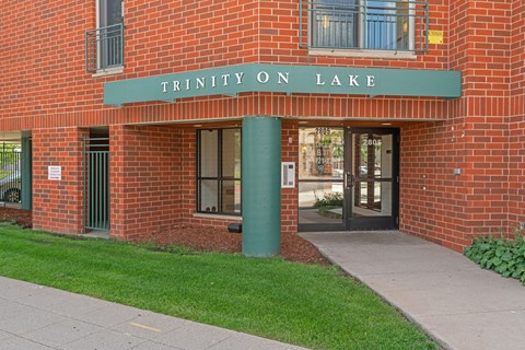 the entrance to the trinity on lake building
