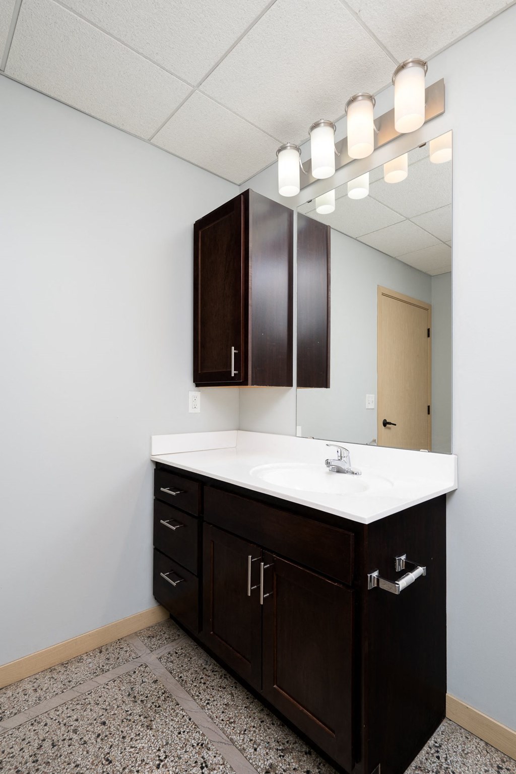 a bathroom with a sink and a mirror