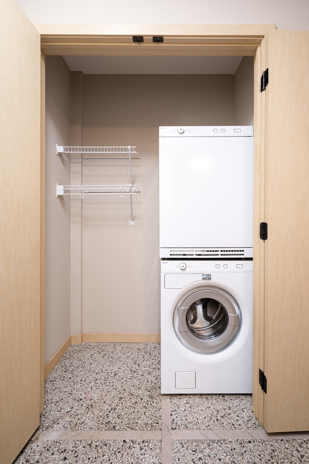a small laundry room with a washing machine and a dryer