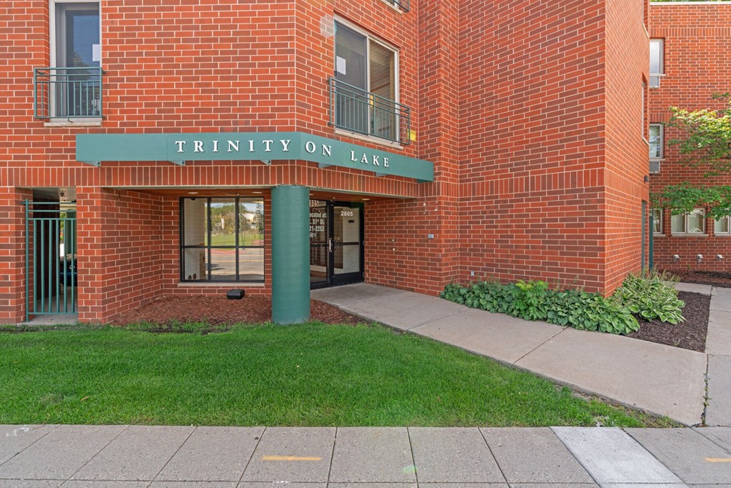the entrance to the trinity on lake building