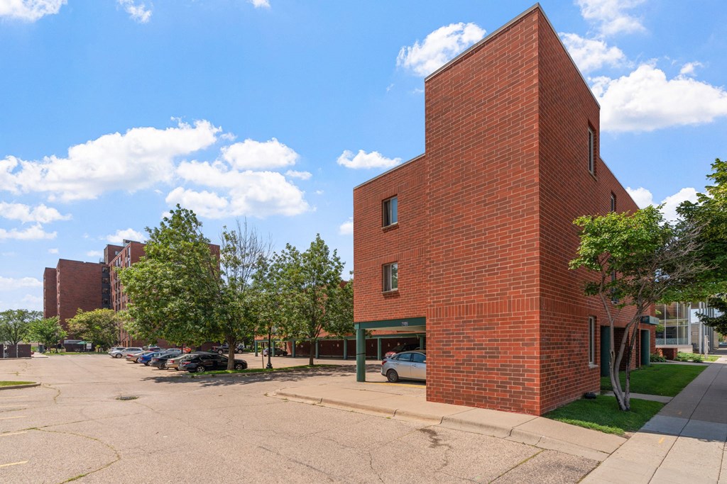 a red brick building on the corner of a street