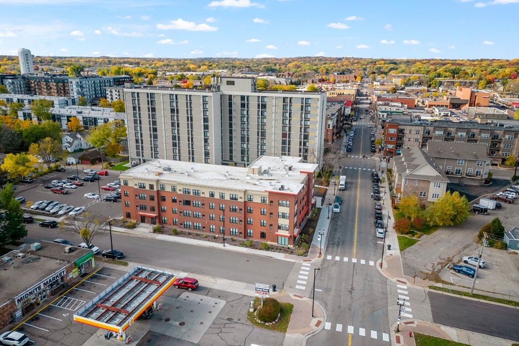 an aerial view of a city street and a large building