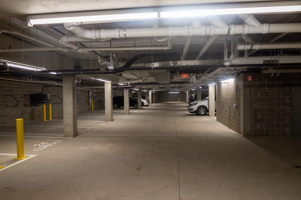 a large parking garage with a car parked in it