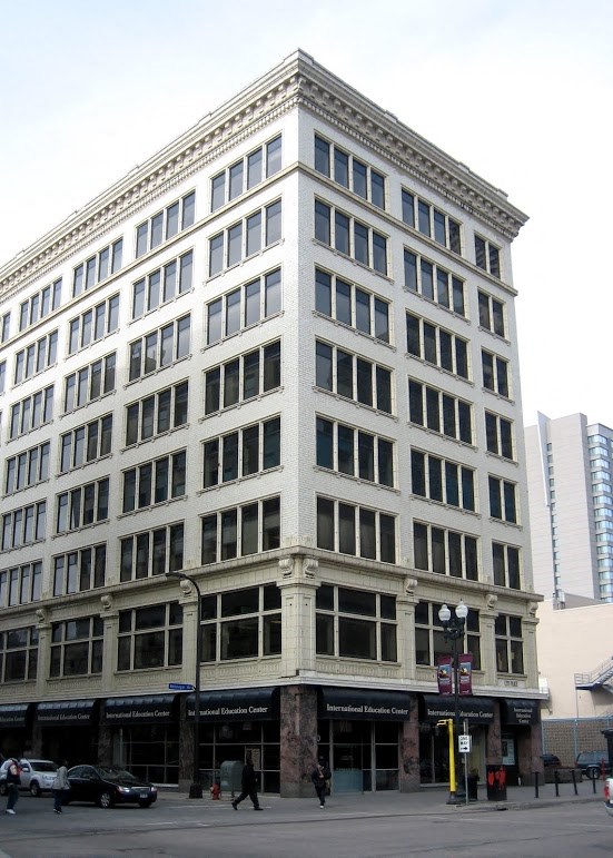 a large building on the corner of a city street