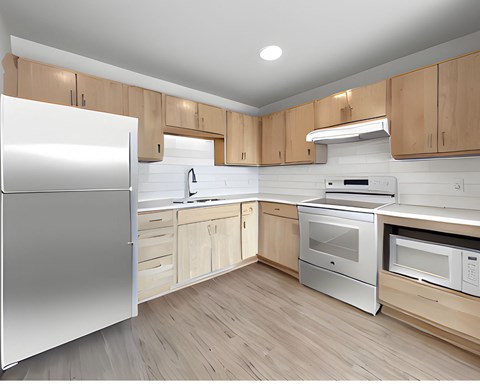 A modern kitchen with wooden cabinets and stainless steel appliances.