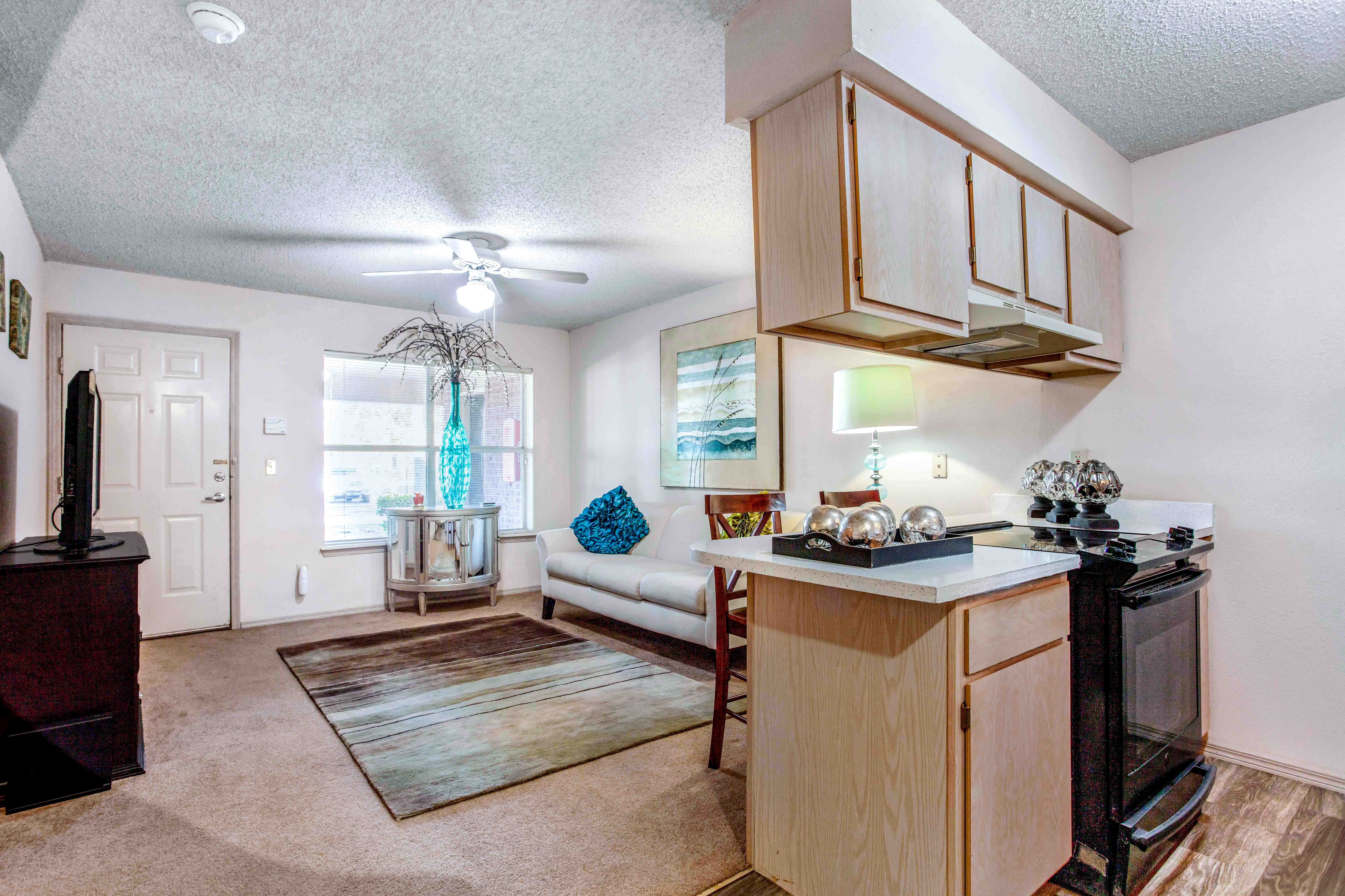 an open living room and kitchen with a couch and a table