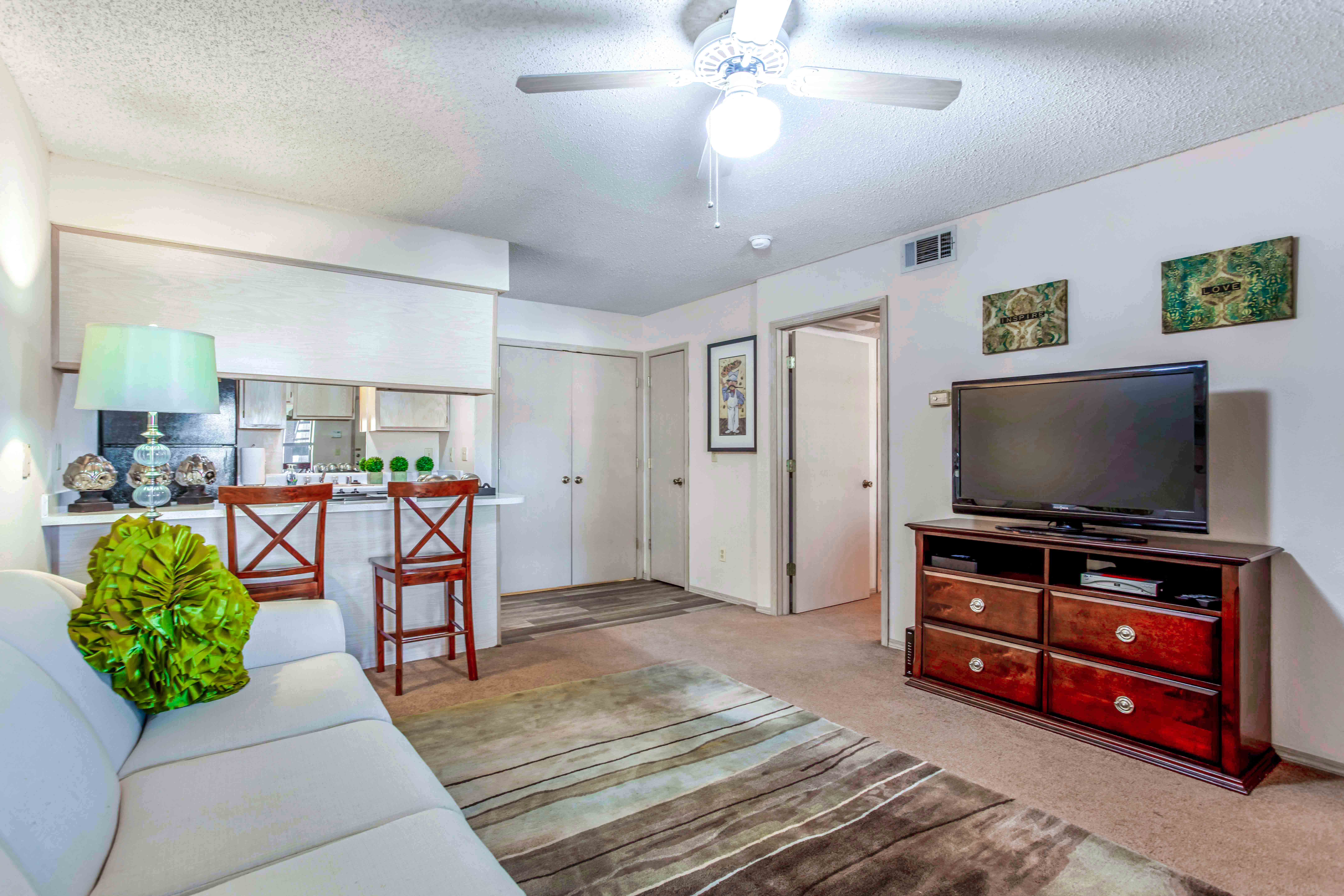 a living room with a couch and a tv