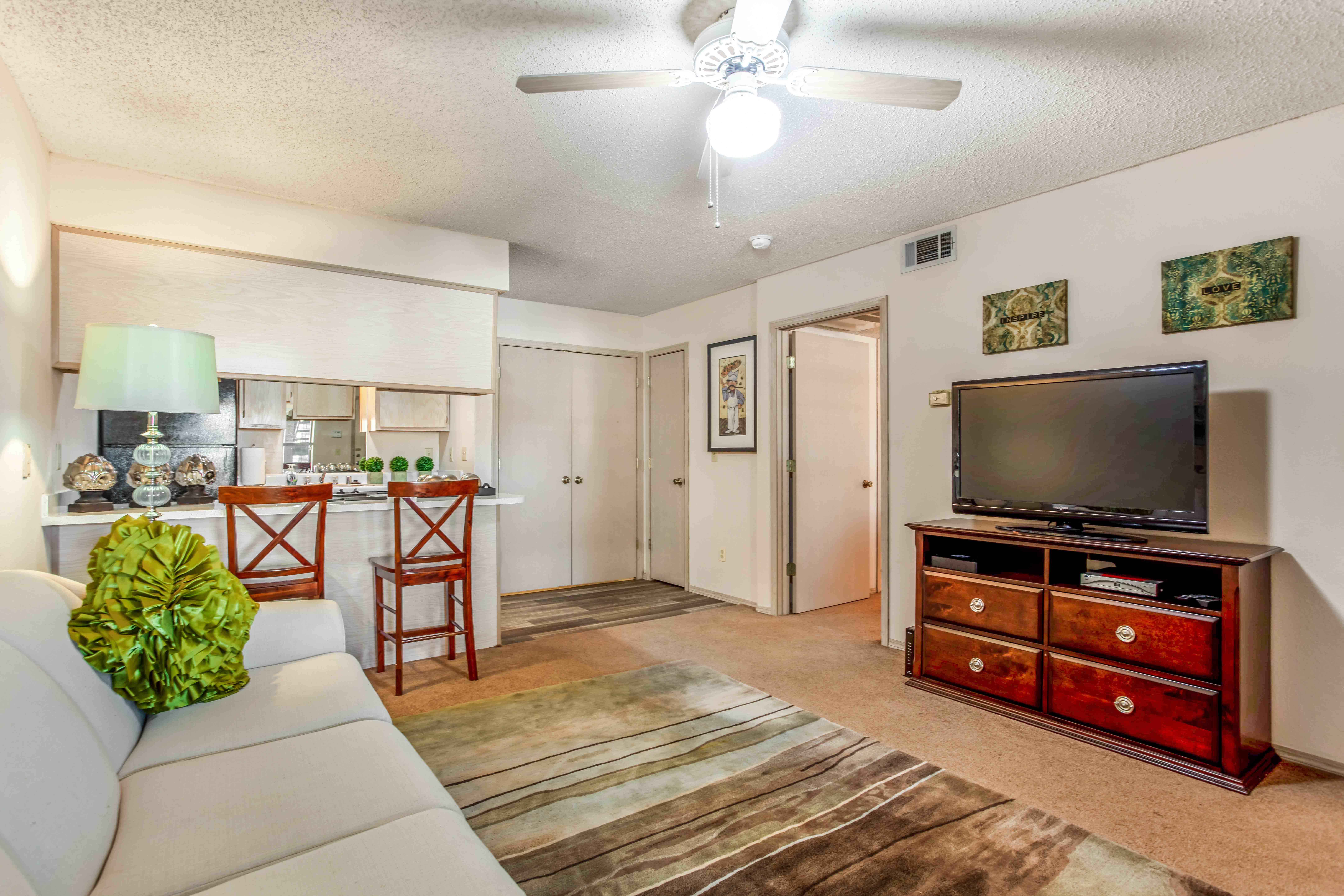 a living room with a couch and a tv