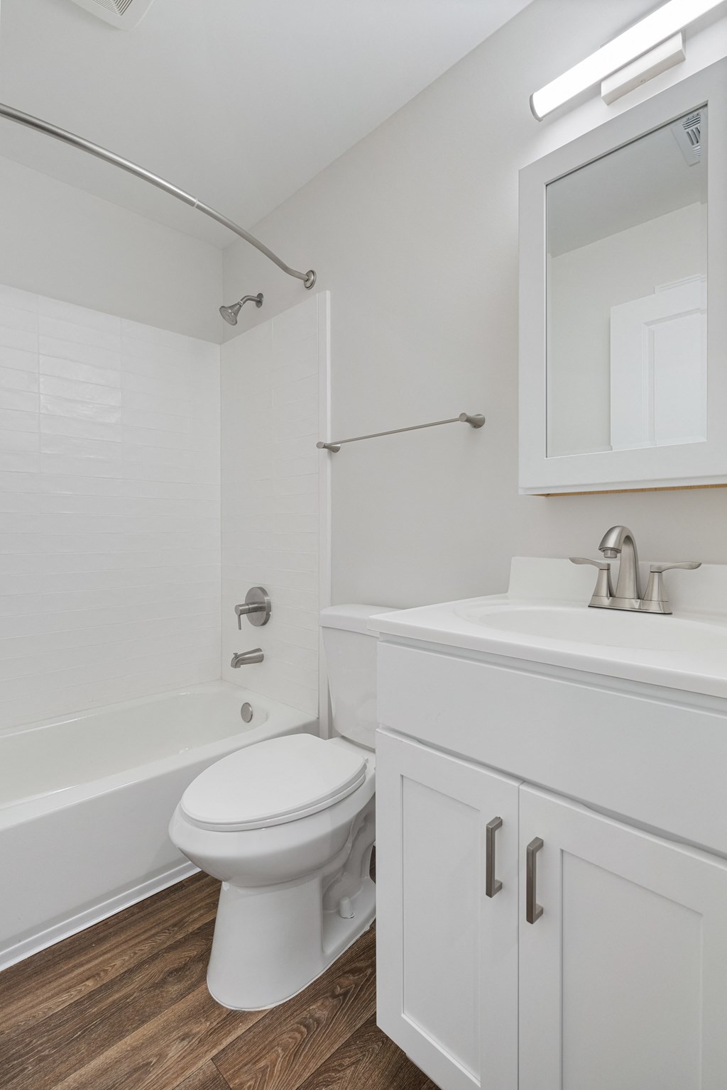an empty bathroom with a toilet and a sink