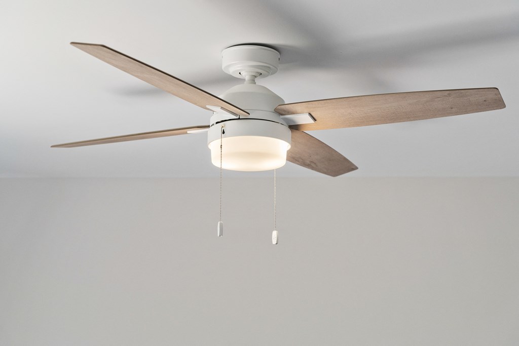 a ceiling fan with a light hanging from it
