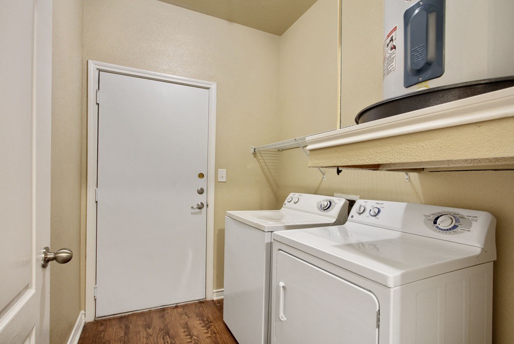 a small laundry room with a washer and dryer