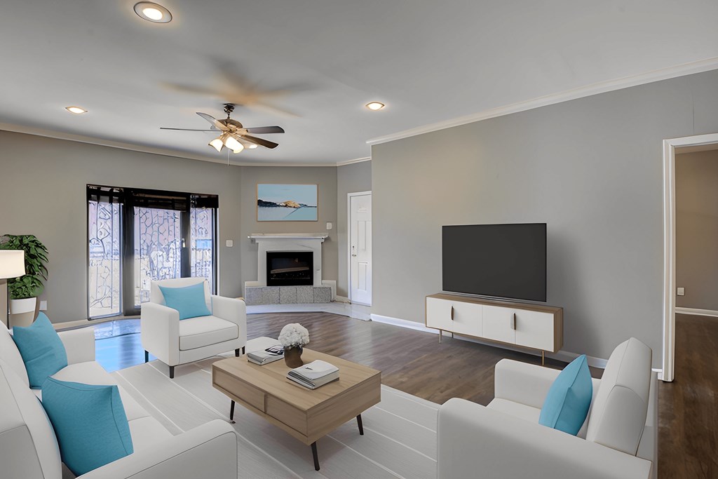 A living room with a fireplace and a television.