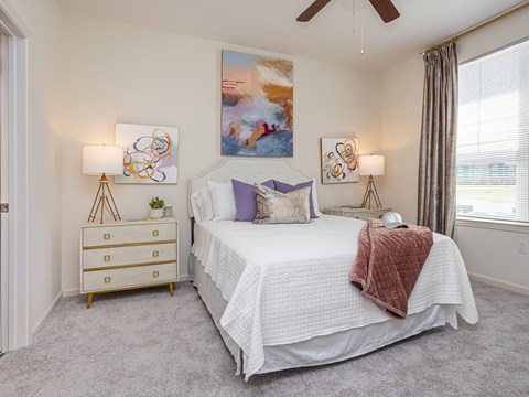 a bedroom with a bed and a dresser