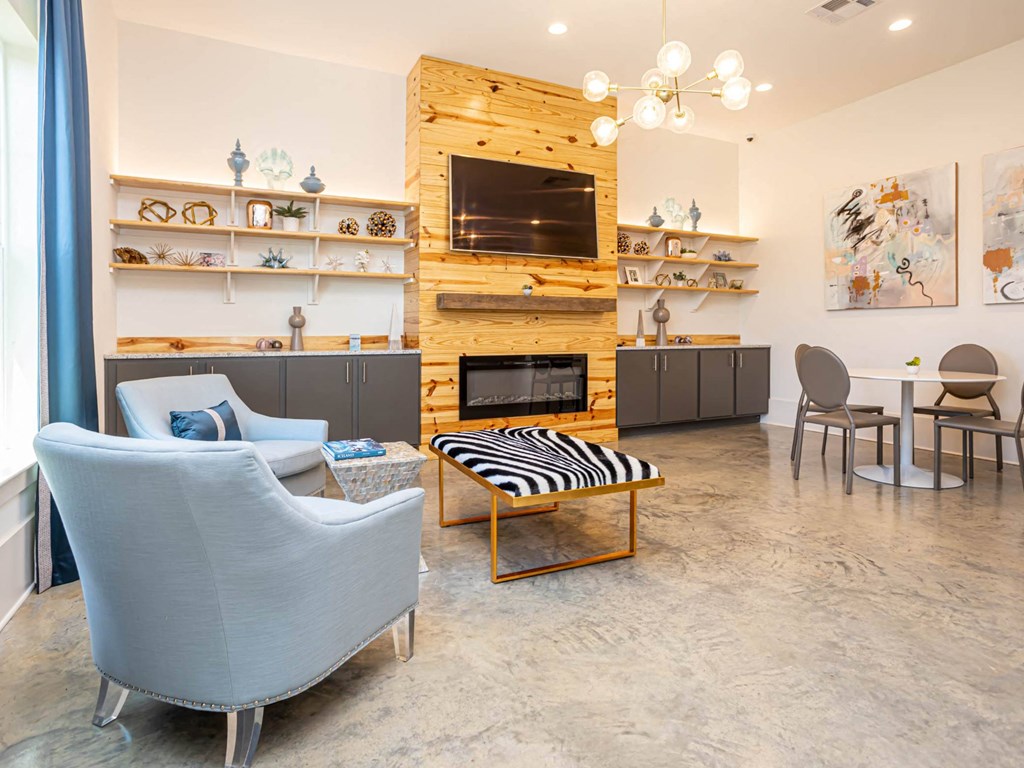 a living room with a couch and a fireplace