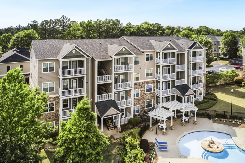an aerial view of an apartment complex with a pool and hot tub