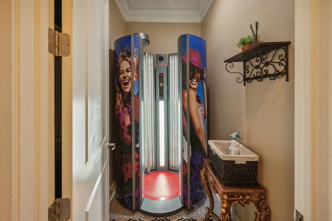 a bathroom with three old fashioned refrigerators in it