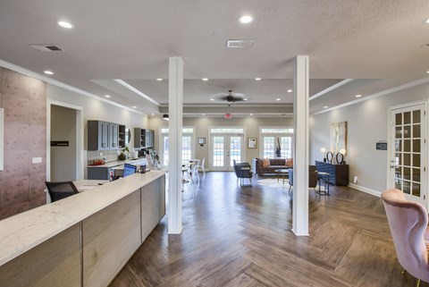 a resident clubhouse with a kitchen and living room