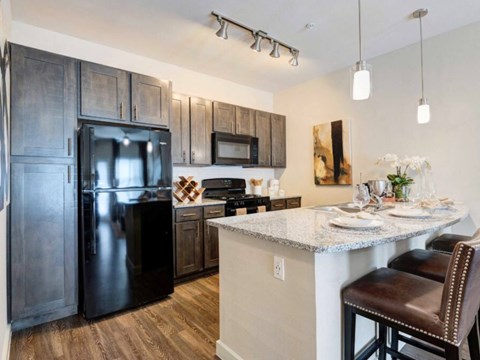 a kitchen with stainless steel appliances and a granite counter top
