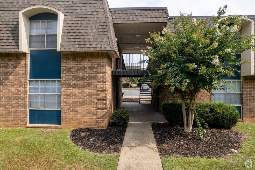 a view of the front of a house with a walkway