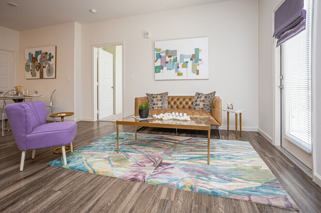 a living room with a couch and a rug