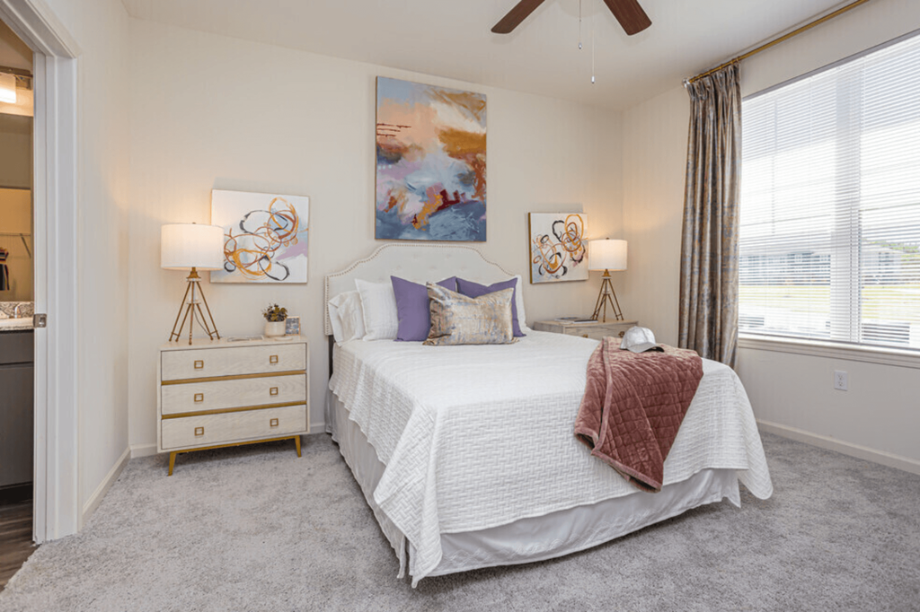 a bedroom with a bed and a dresser