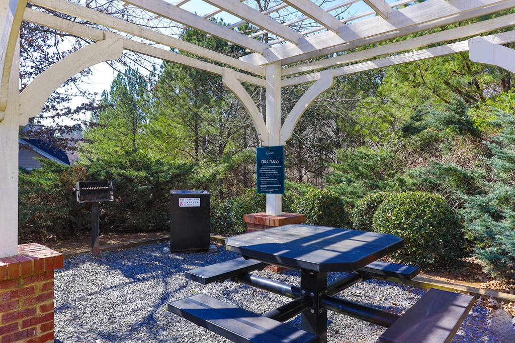 a picnic area with a table and benches