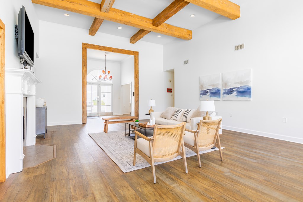 A living room with wooden floors and furniture.