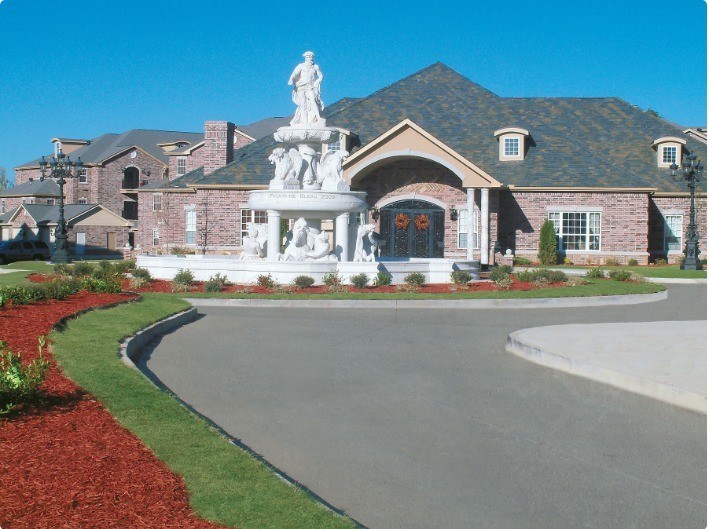 A house with a statue in front of it.