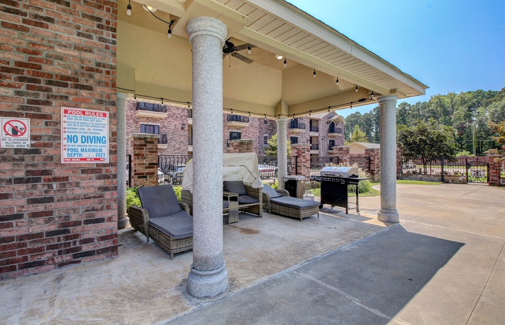 A covered patio area with a no diving sign.